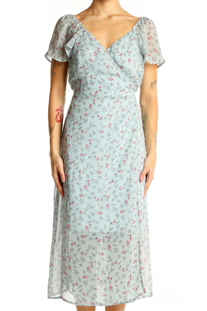 Front view of mint floral wrap midi dress with short sleeves