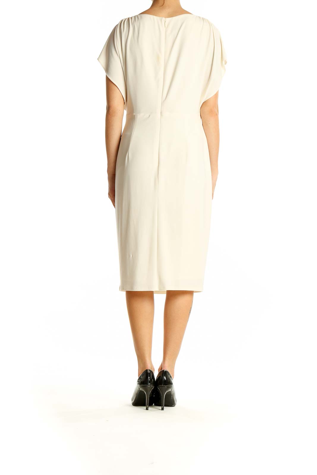 Side view of Anne Klein cream draped midi dress showing elegant silhouette