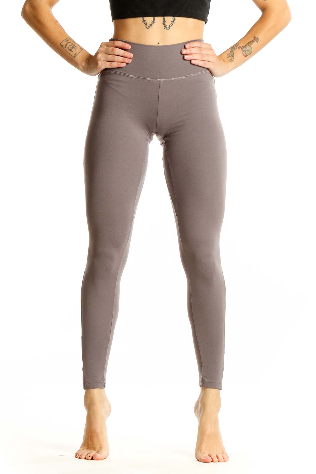 Front view of Gymshark taupe high-waisted performance leggings