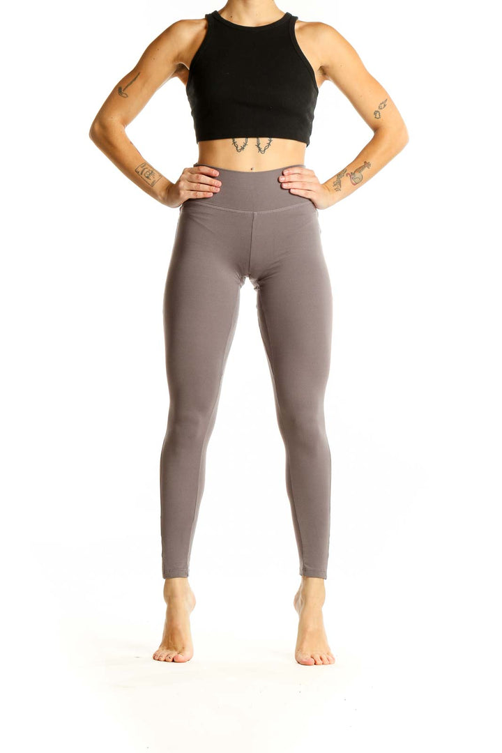 Front view of Gymshark taupe high-waisted performance leggings