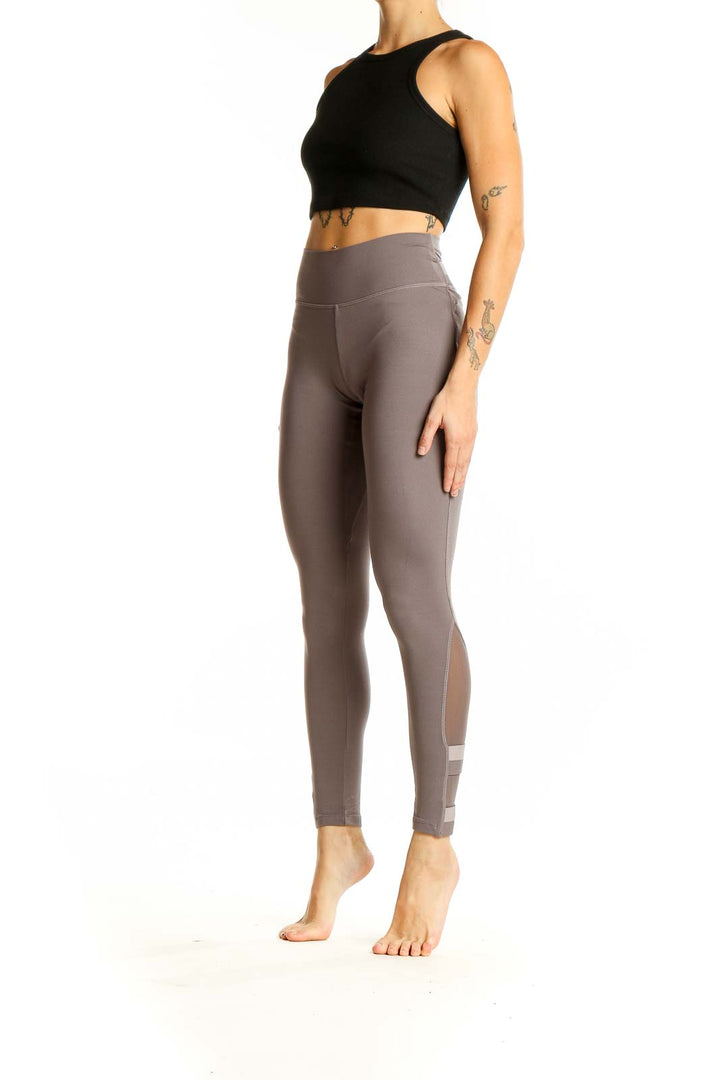 Front view of Gymshark taupe high-waisted performance leggings