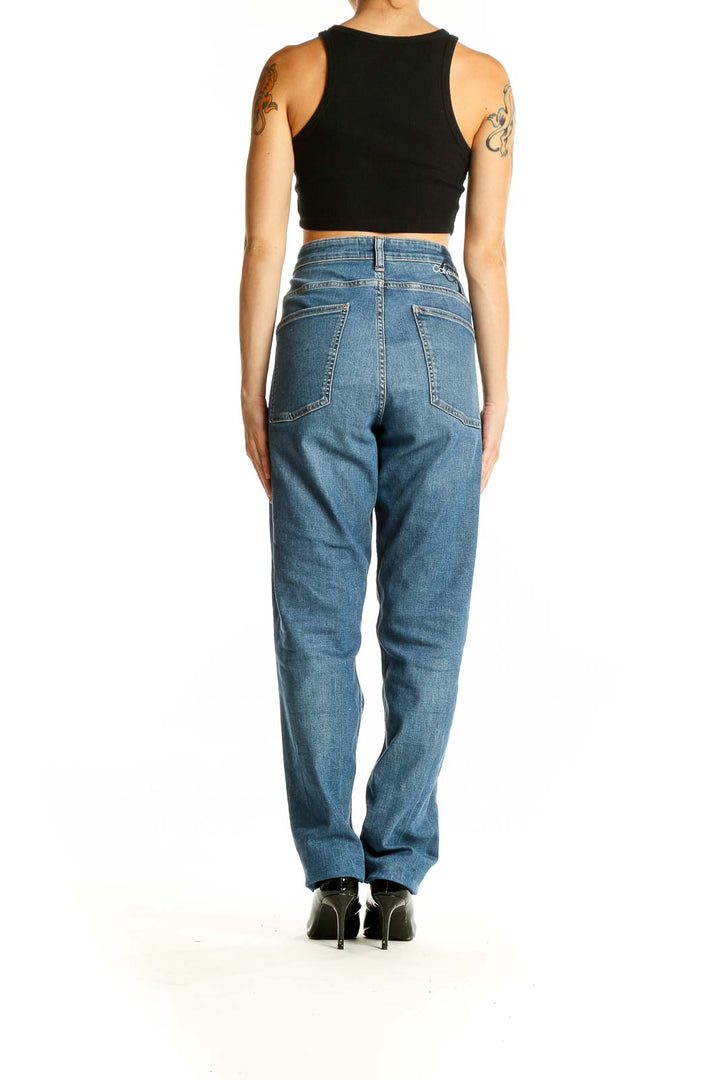 Back view of Calvin Klein blue high-waisted straight leg jeans on model