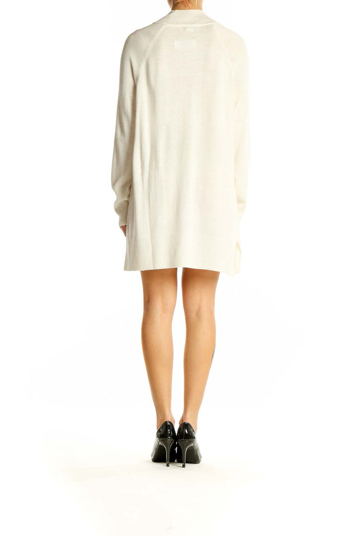 Side view of cream oversized mock neck sweater dress from Coldwater Creek