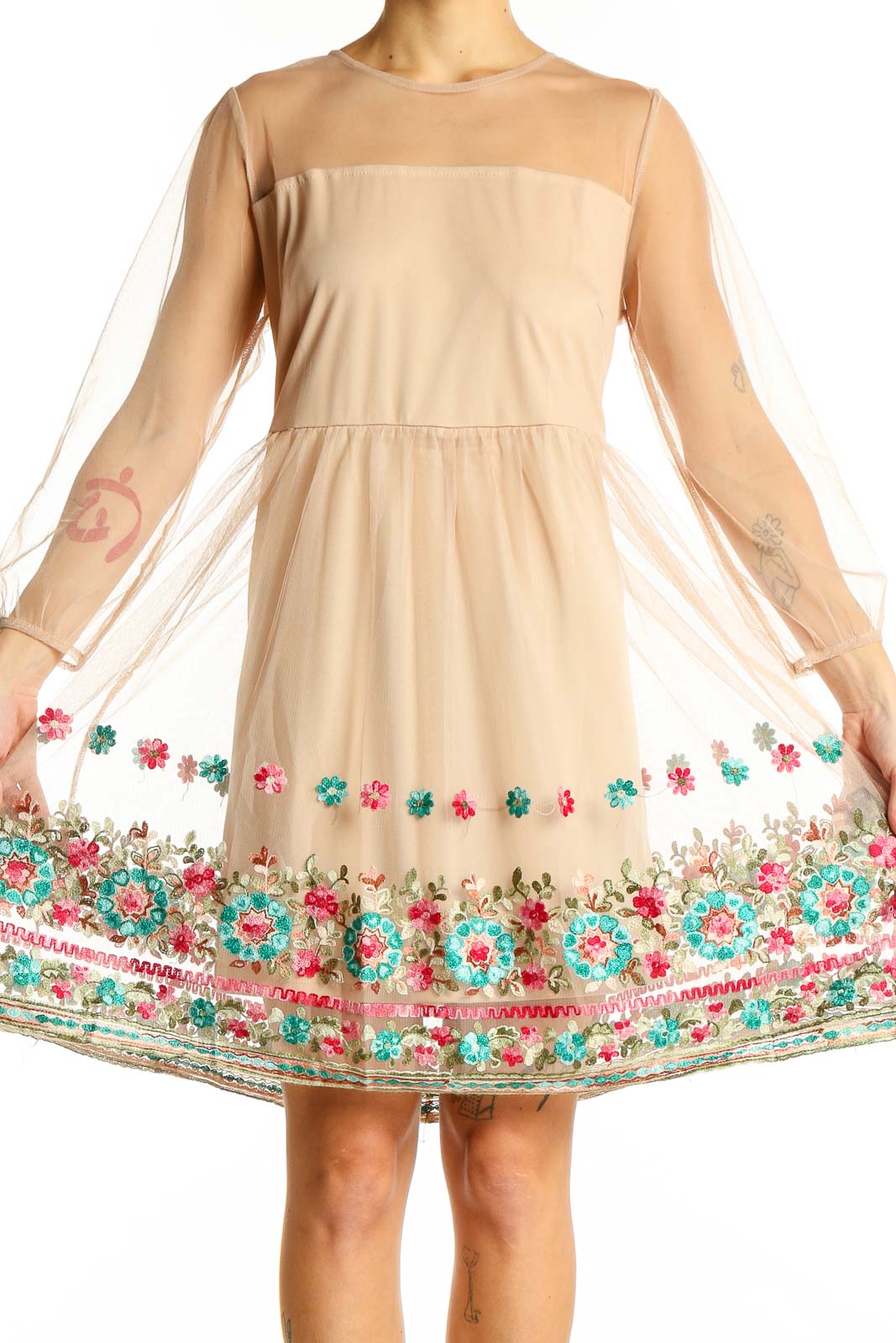 Front view of Entro beige dress with sheer overlay and floral embroidery