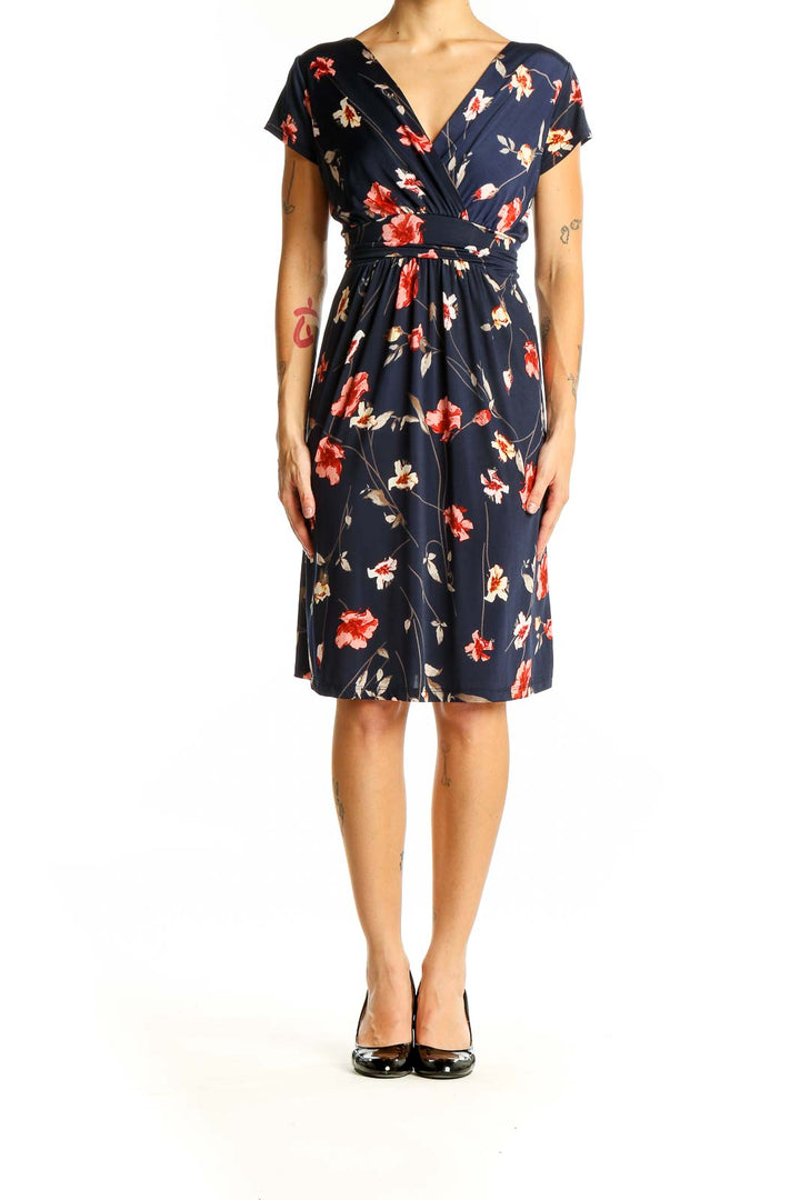 Front view of Kaileigh navy floral wrap midi dress with V-neckline and short sleeves