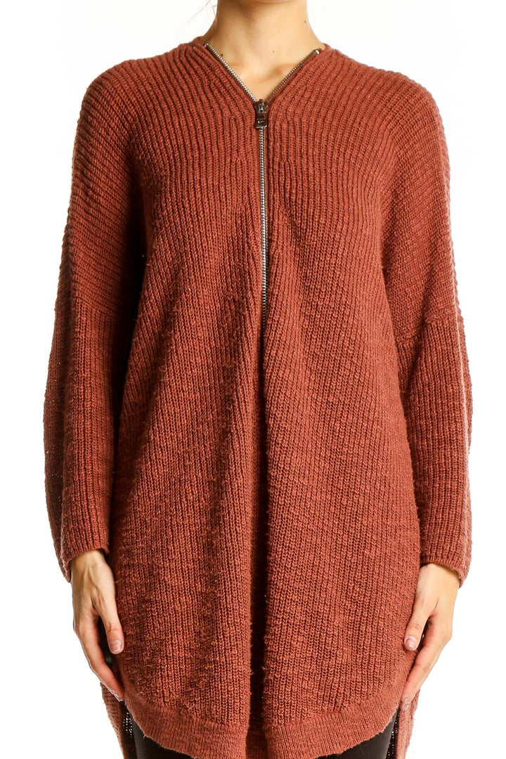 Front view of Express rust ribbed zip-front cardigan on model