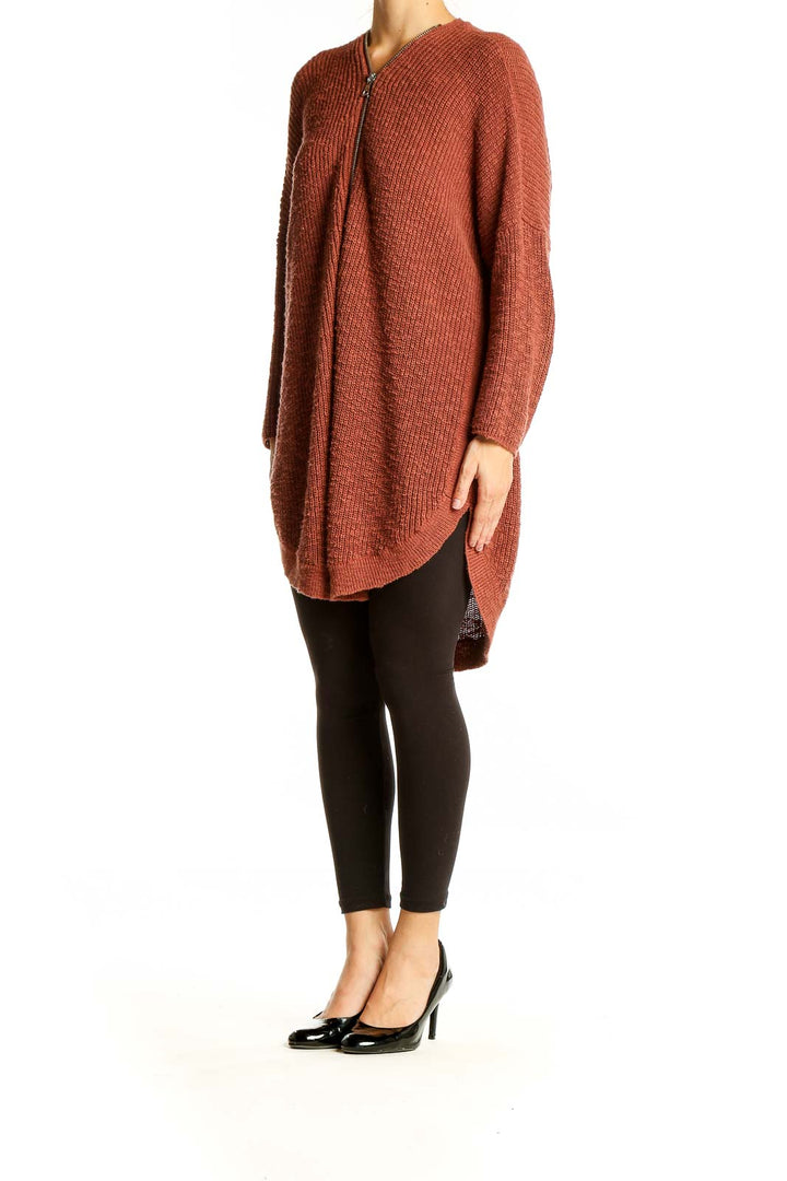 Front view of Express rust ribbed zip-front cardigan on model