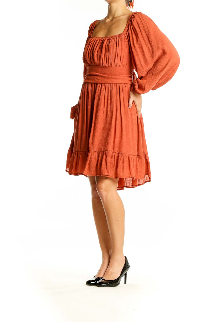 Front view of terracotta SilkRoll midi dress with square neckline and tiered skirt