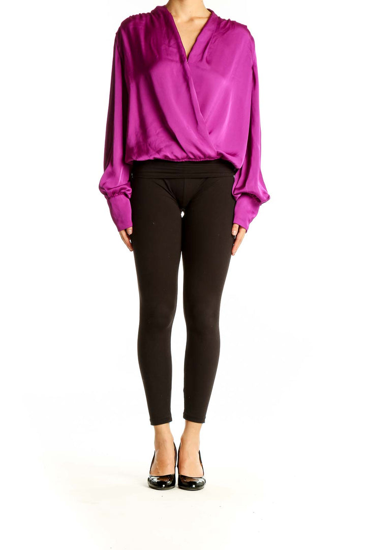 Front view of magenta wrap-style polyester blouse from Express