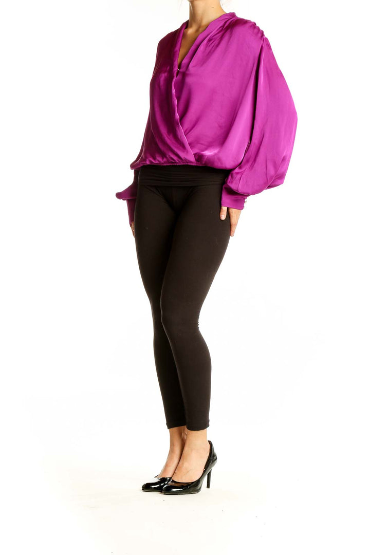 Front view of magenta wrap-style polyester blouse from Express