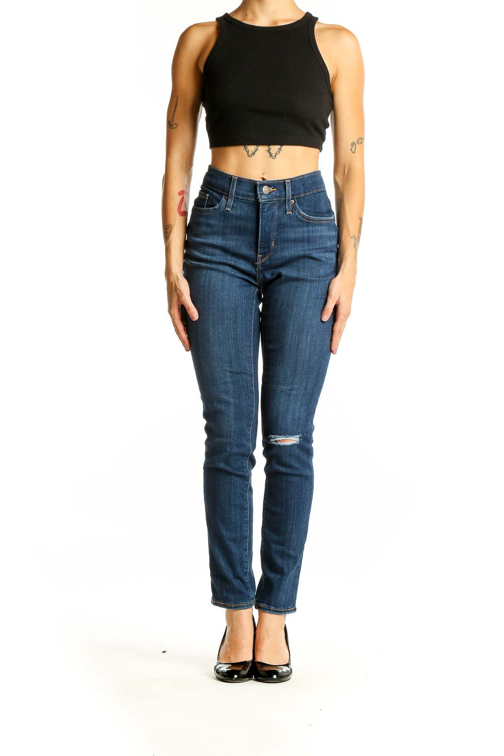 Front view of Levi's blue distressed skinny jeans on model