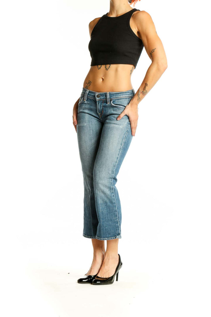 Front view of Citizens of Humanity light blue cropped flare jeans on model