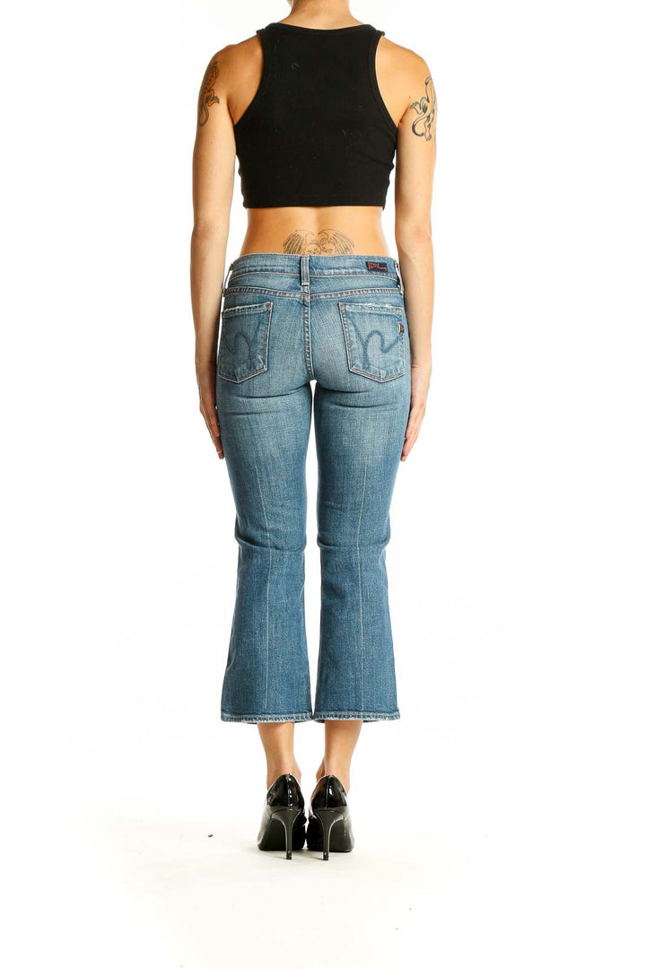 Back view of Citizens of Humanity light blue cropped flare jeans on model