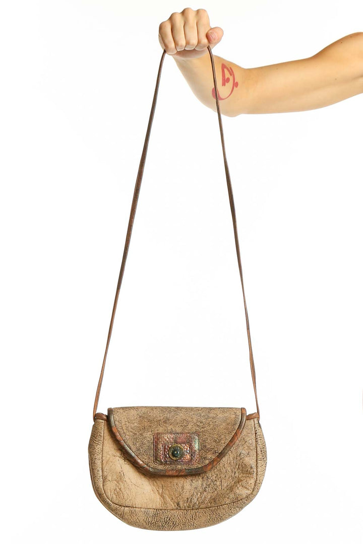 Front view of tan vintage-inspired crossbody bag from Pat Smiley Collection