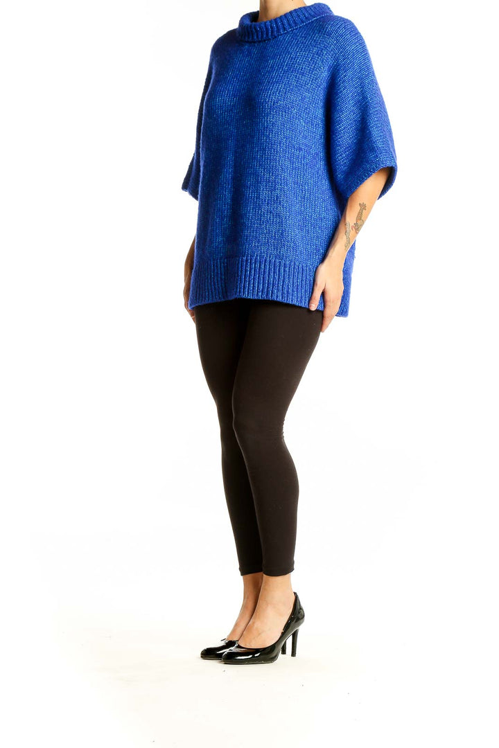 Front view of blue oversized knit sweater from Club Monaco