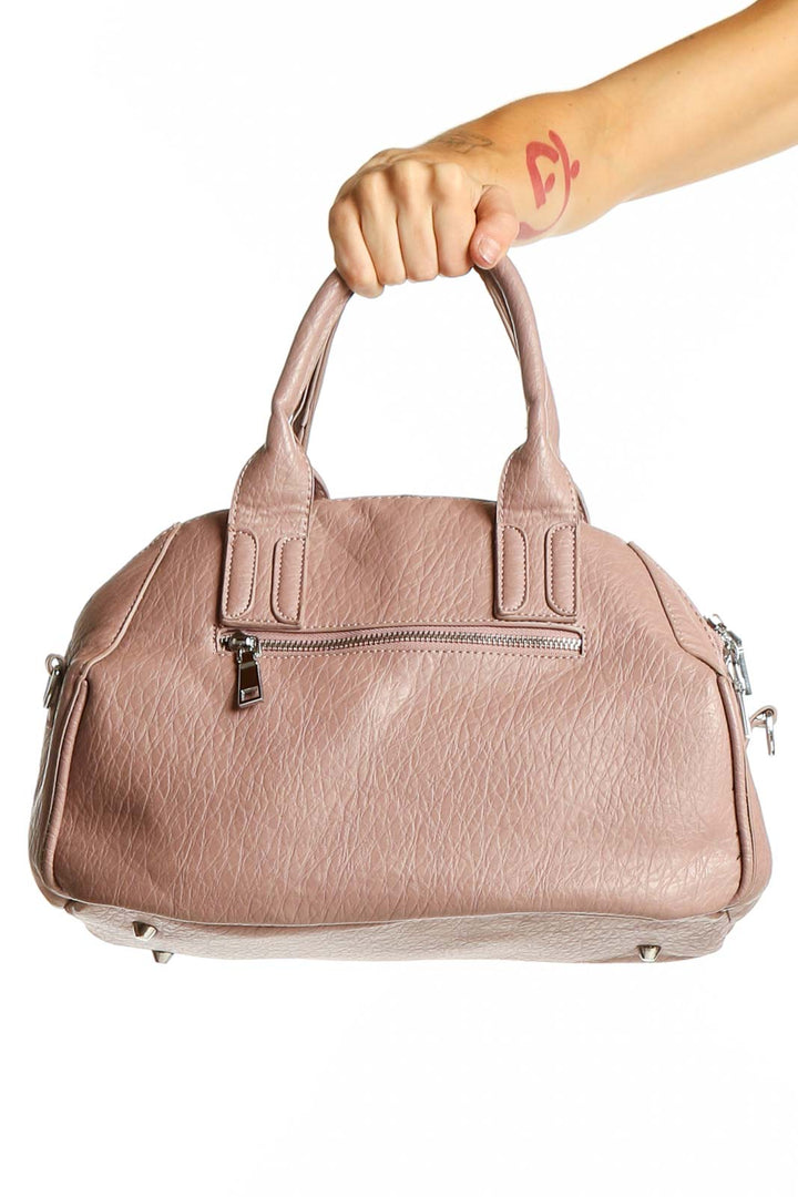 Front view of Madison West blush pink textured crossbody bag