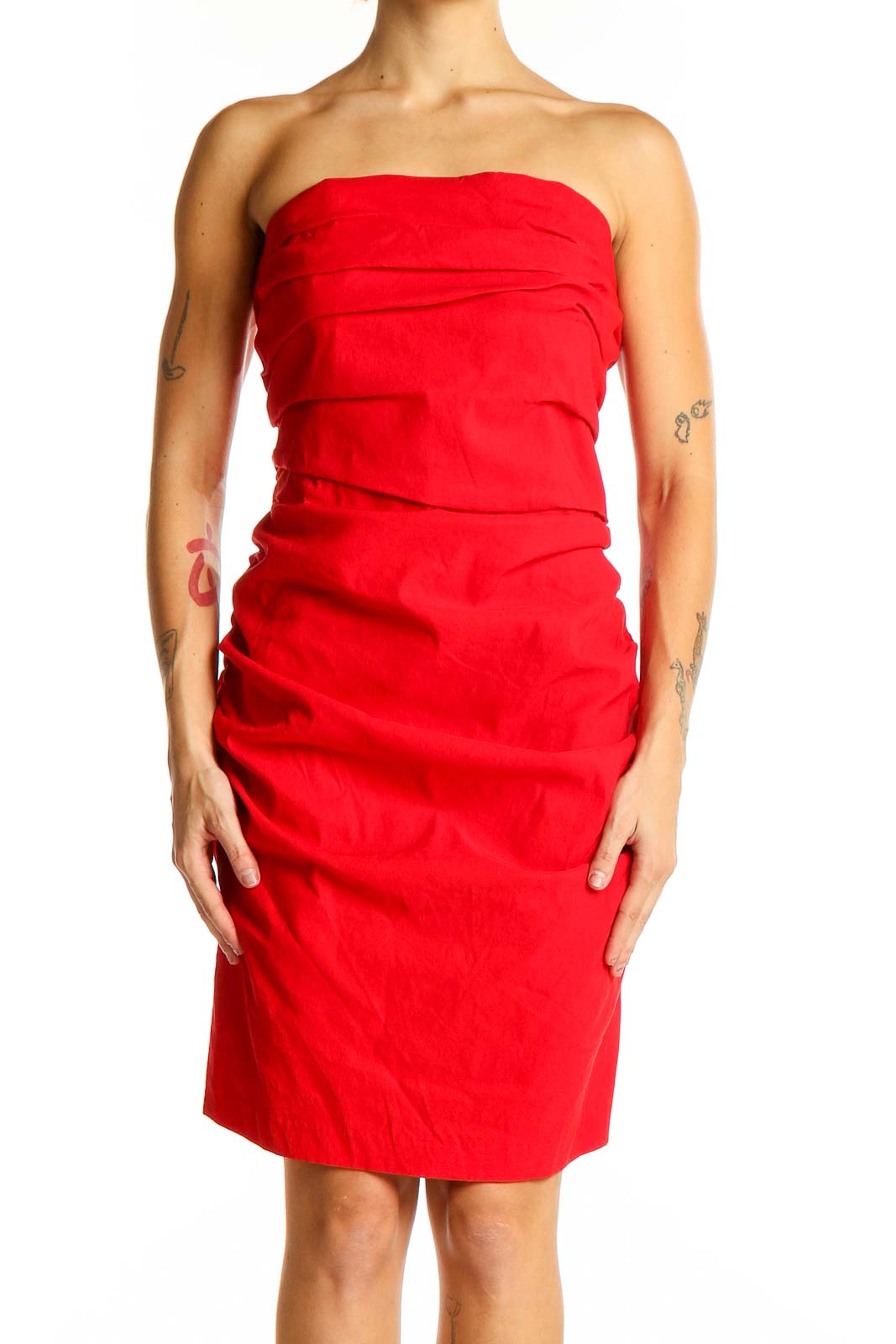 Front view of red strapless ruched cocktail dress from Anthropologie