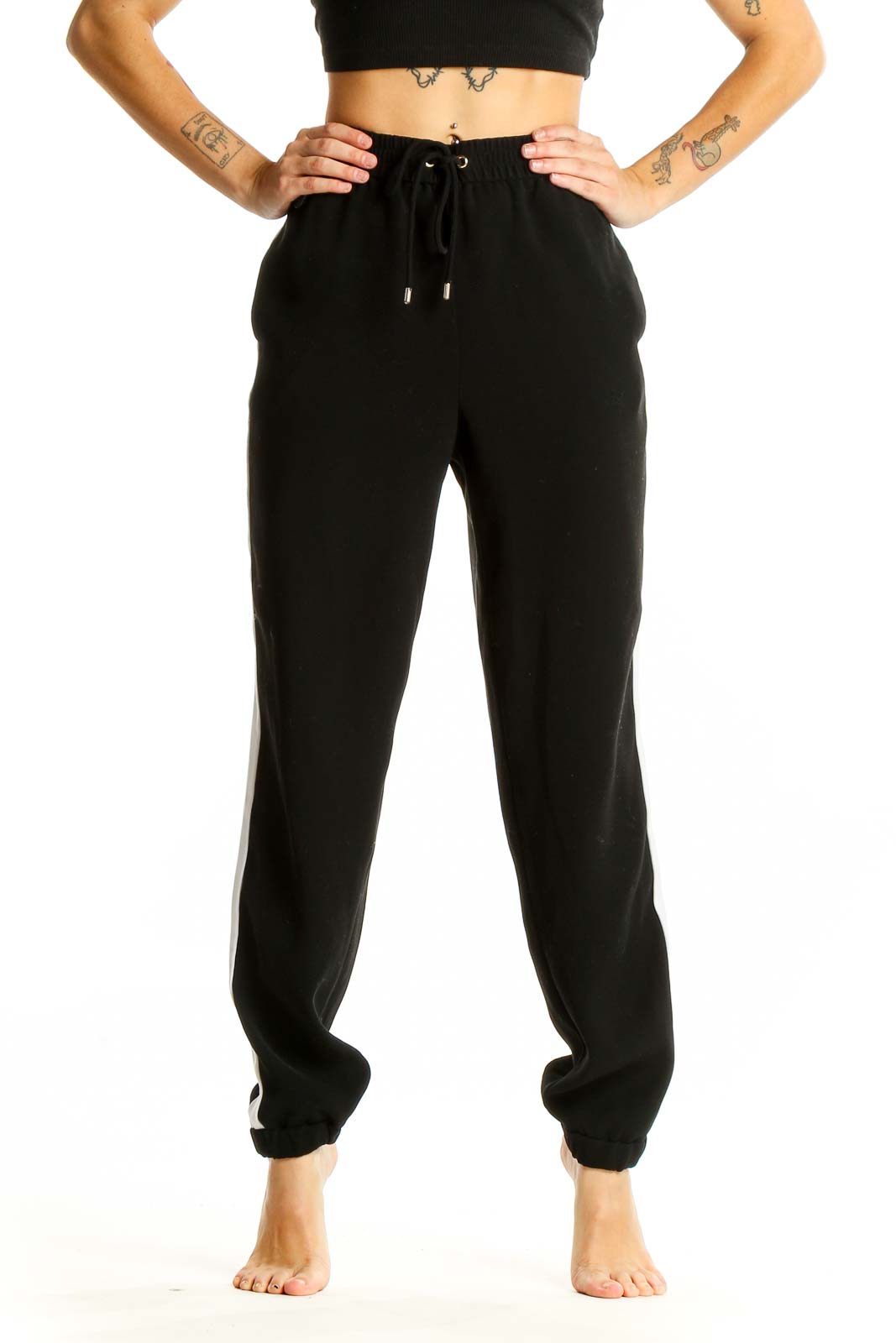 Front view of black MICHAEL Michael Kors jogger pants with white side stripe