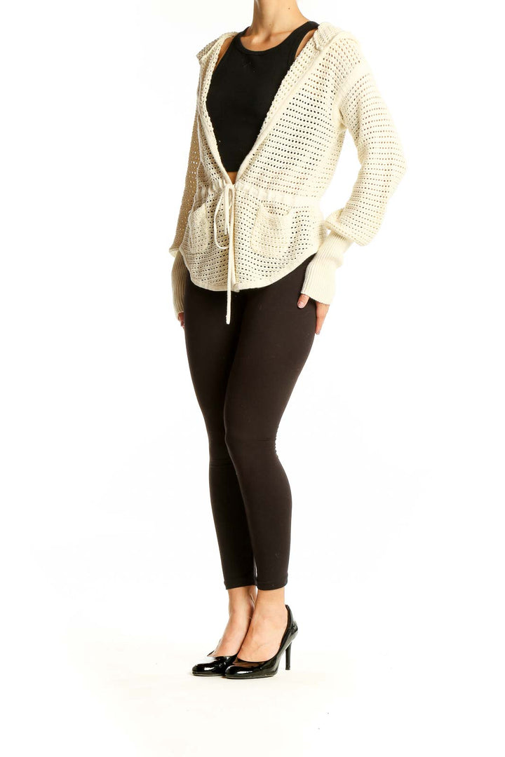 Front view of cream Free People hooded open-knit cardigan with tie closure