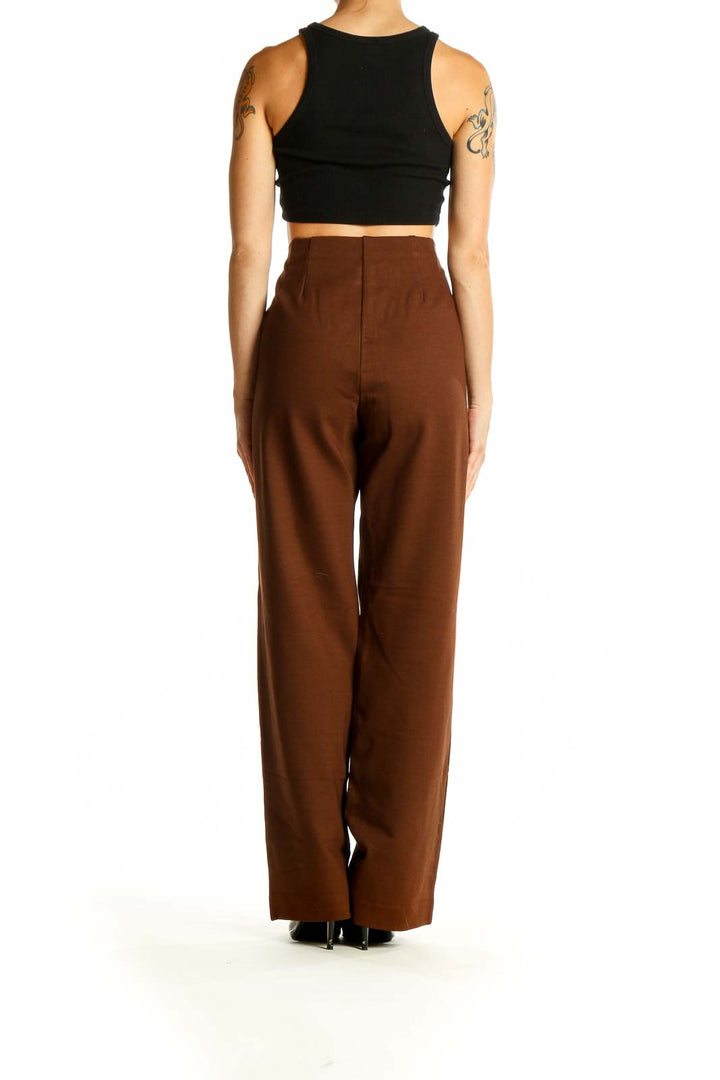 Side view of model wearing brown high-waisted wide-leg trousers from Coldwater Creek