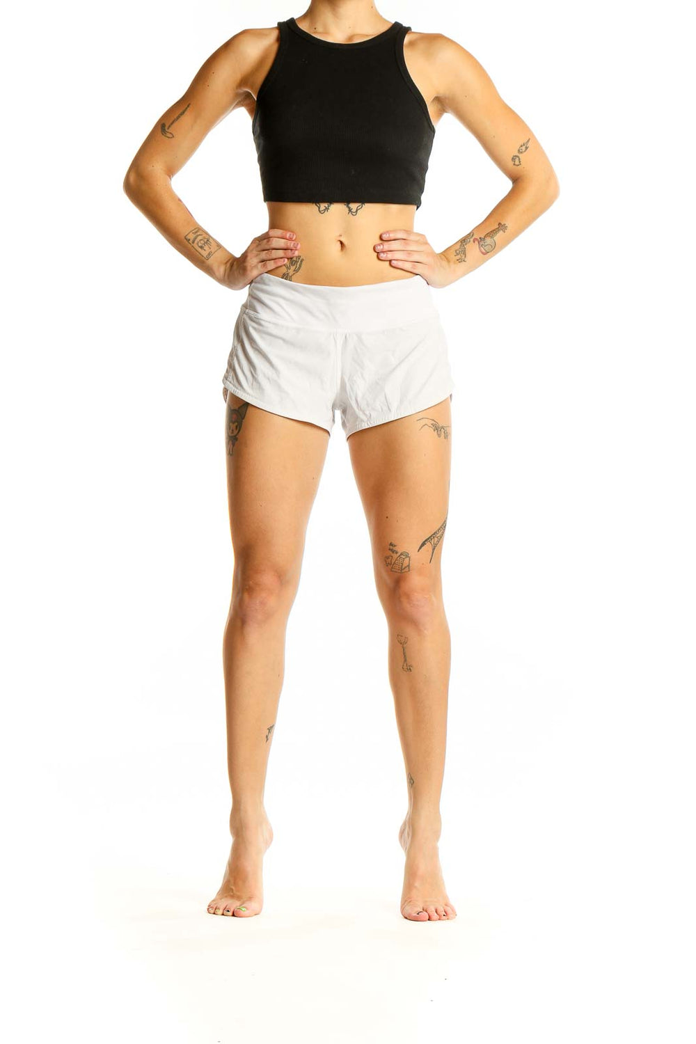 Front view of white Lululemon athletic shorts on model