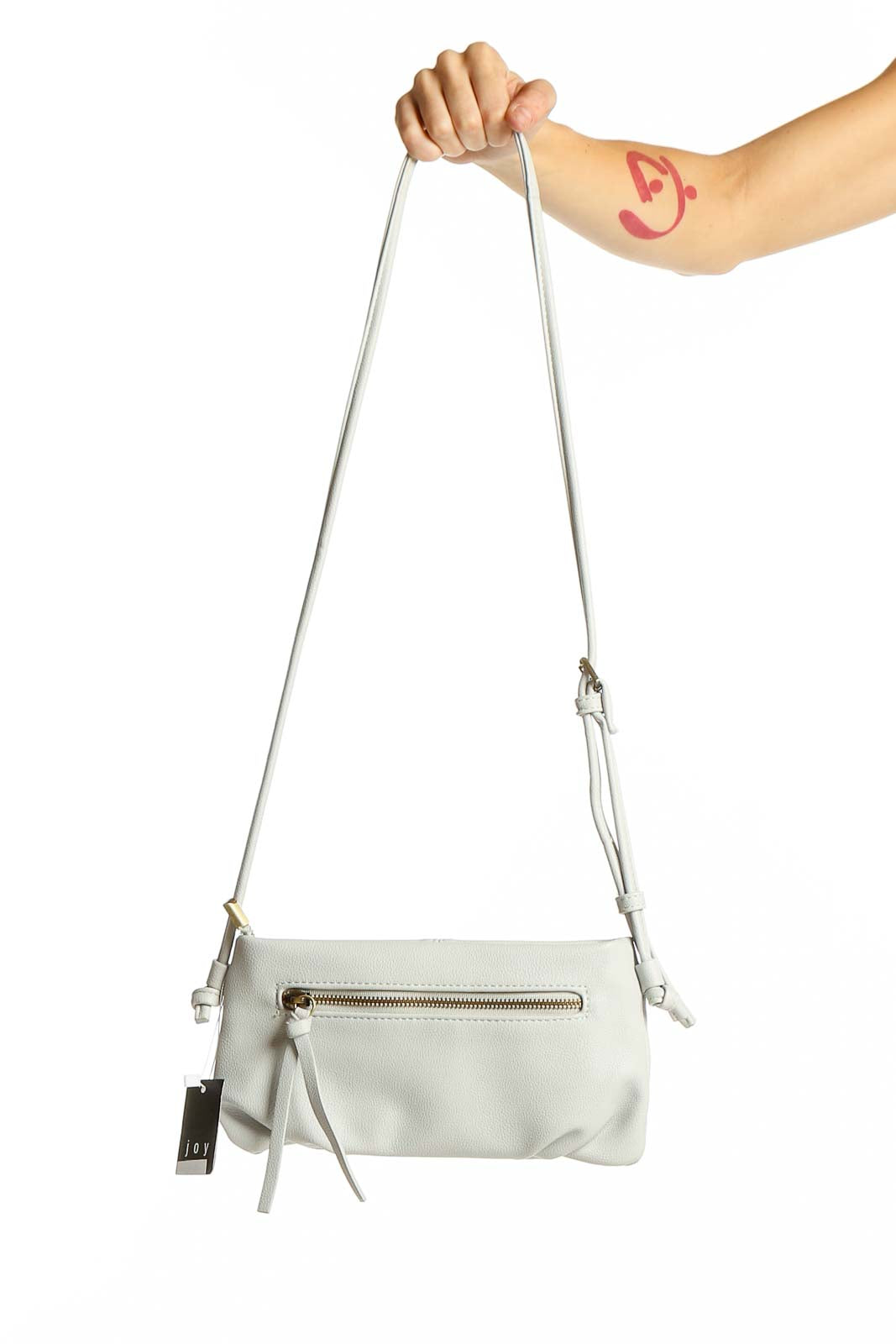 Front view of white Joy Susan crossbody clutch with adjustable strap