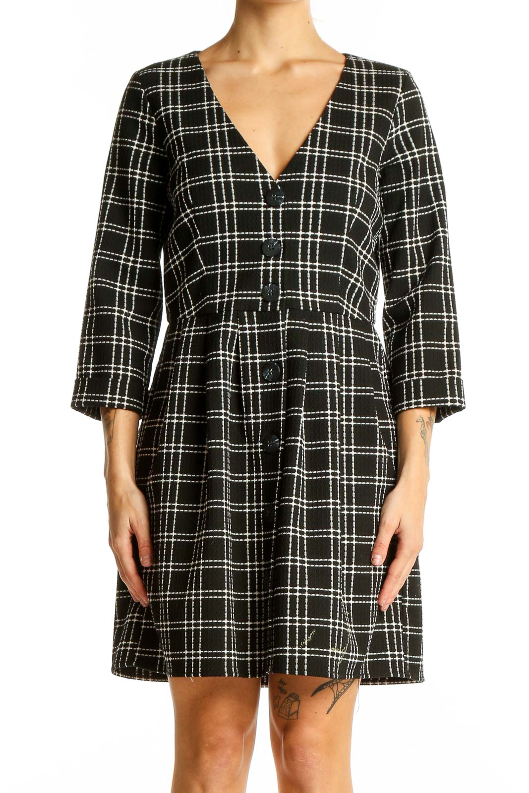 Front view of Zara Trafaluc black and white plaid mini dress with V-neck