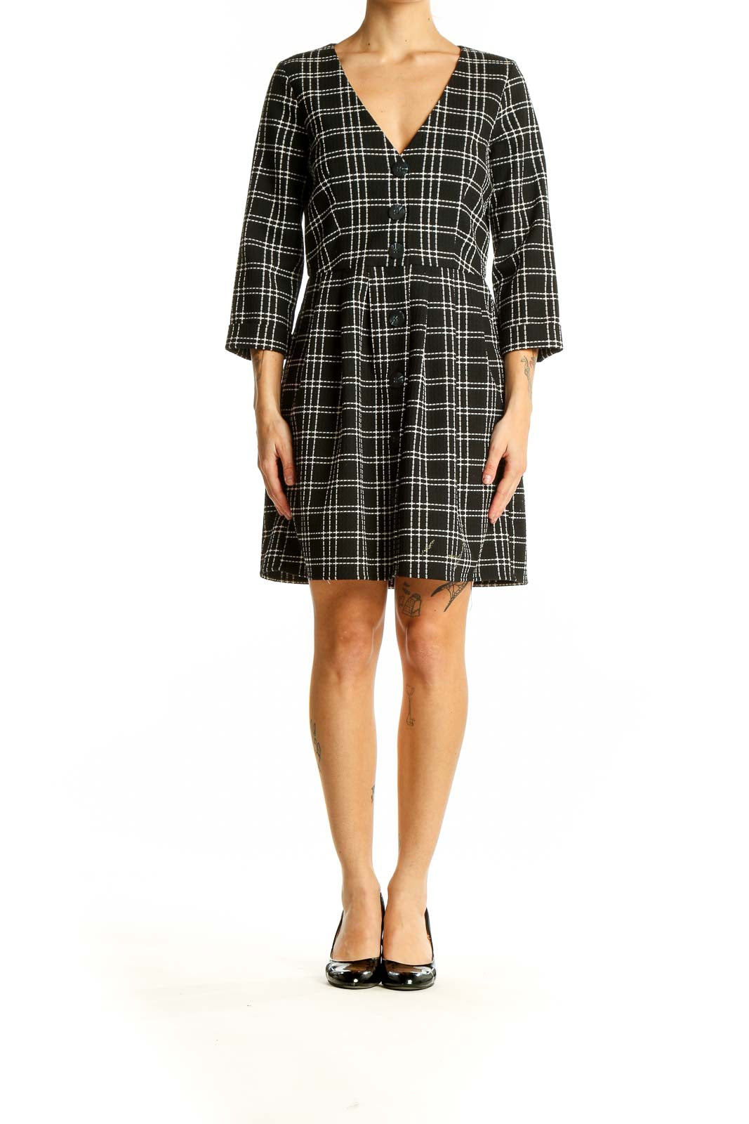 Front view of Zara Trafaluc black and white plaid mini dress with V-neck