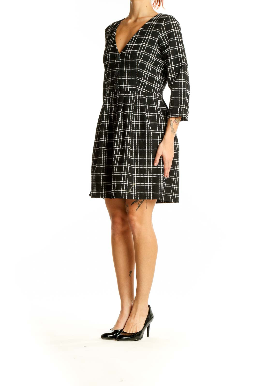 Front view of Zara Trafaluc black and white plaid mini dress with V-neck