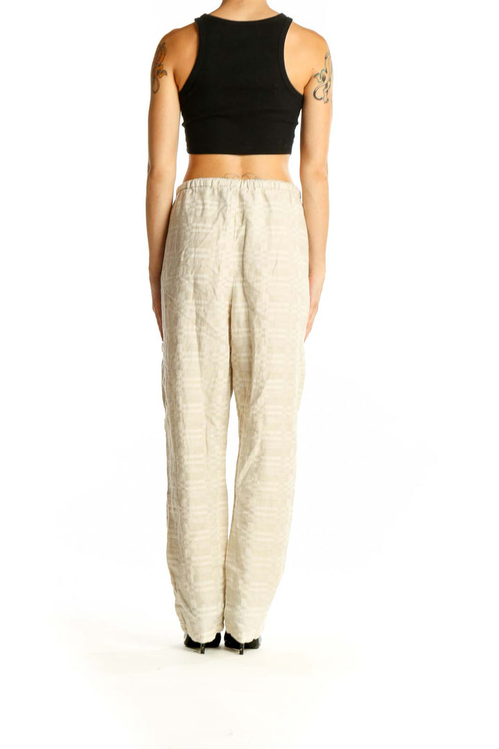 Side view of model wearing beige Coldwater Creek cotton-linen blend relaxed fit pants