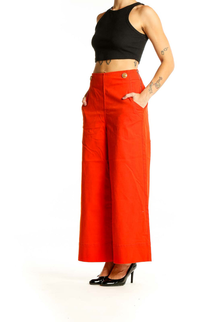 Front view of Maeve red wide-leg pants with gold button details