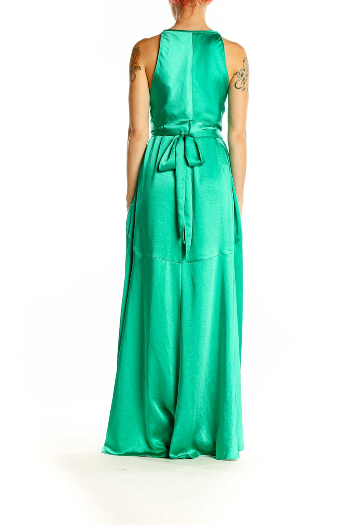 Back view of Ted Baker London green satin maxi dress showing flowing A-line skirt and high-low hemline