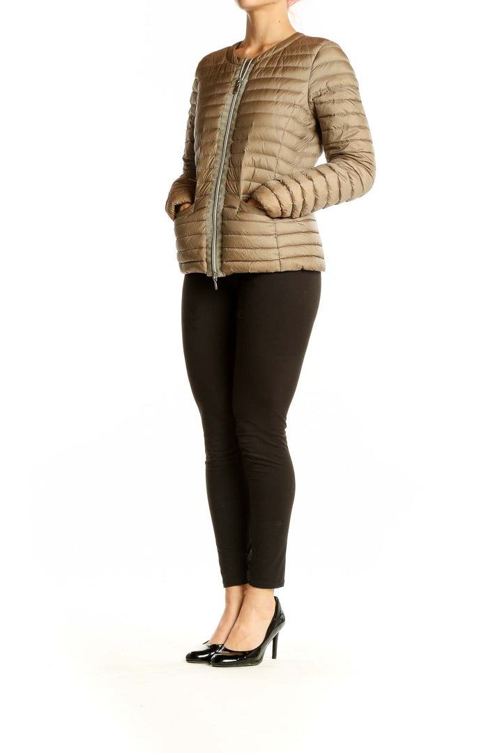 Front view of beige Geox quilted down jacket on model