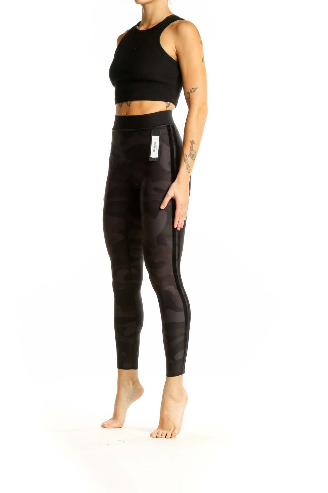 Front view of Ultracor black camo high-waist leggings on model