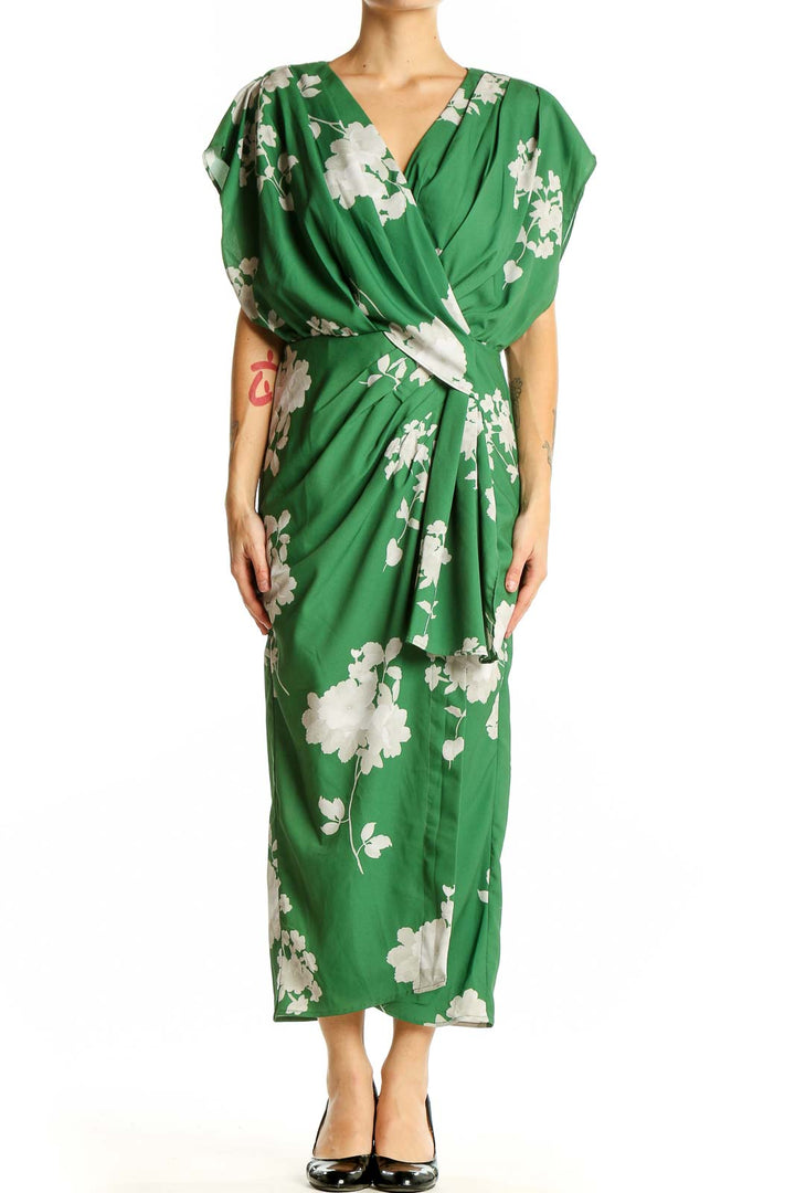 Front view of green floral wrap midi dress by Wayward Fancies