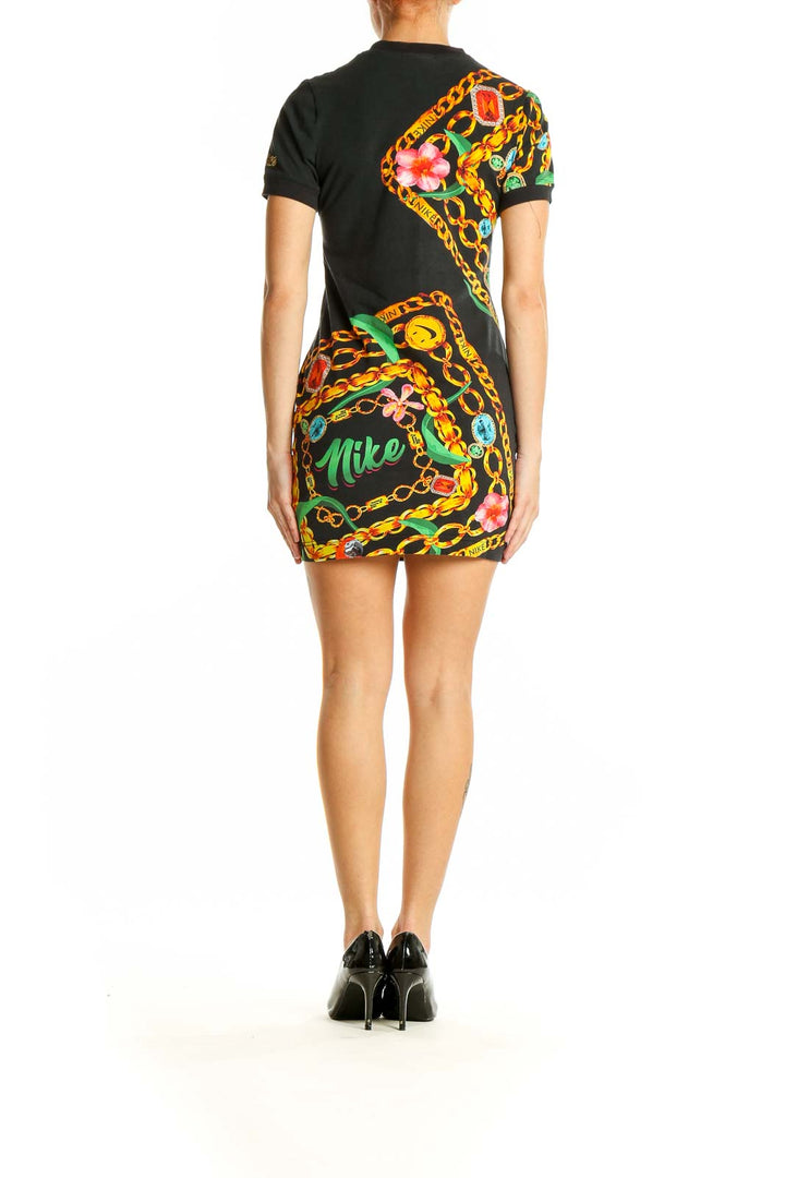 Side view of Nike Black Floral Chain Print Mini Dress showcasing form-fitting silhouette