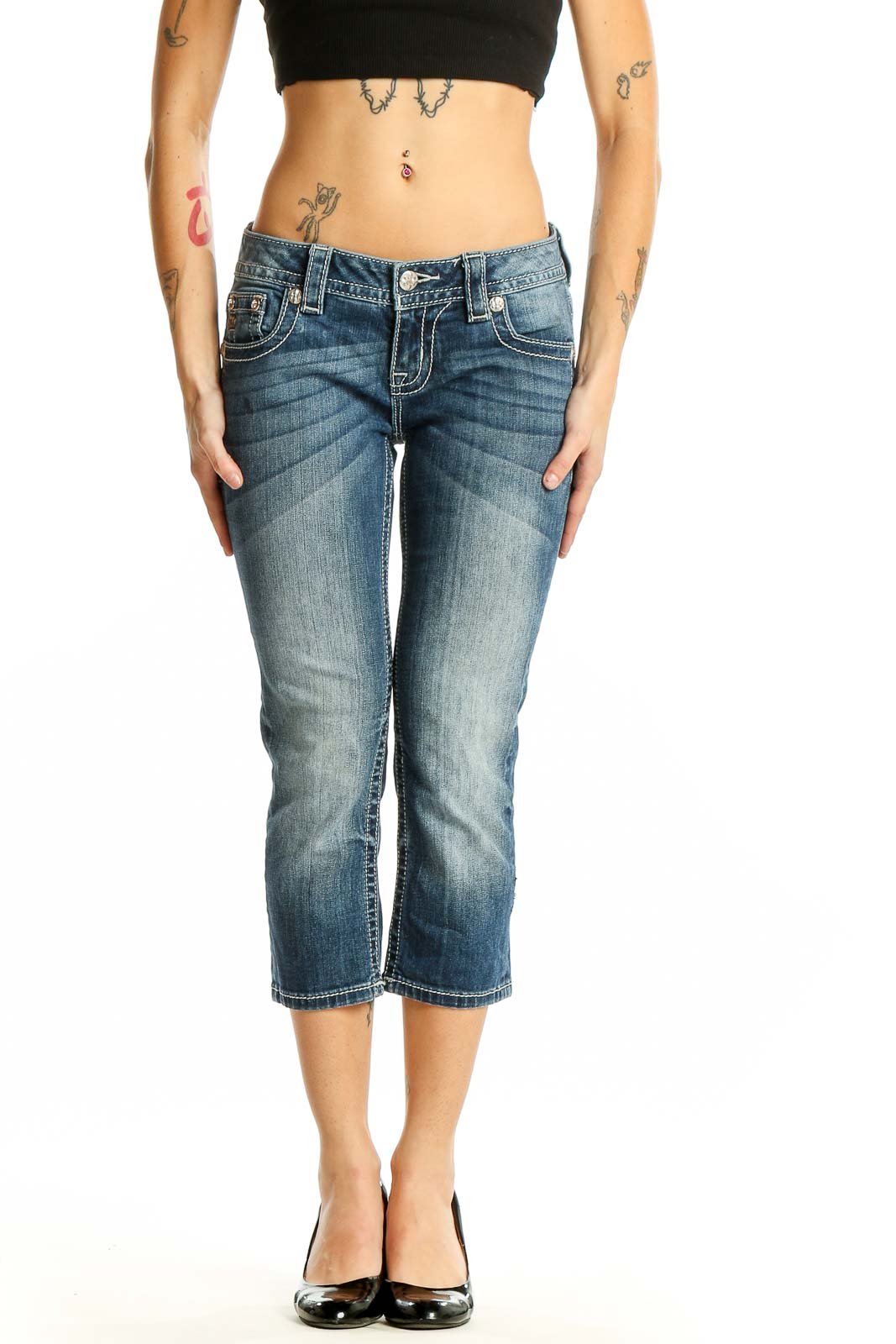 Front view of Miss Me blue faded cropped denim jeans on model