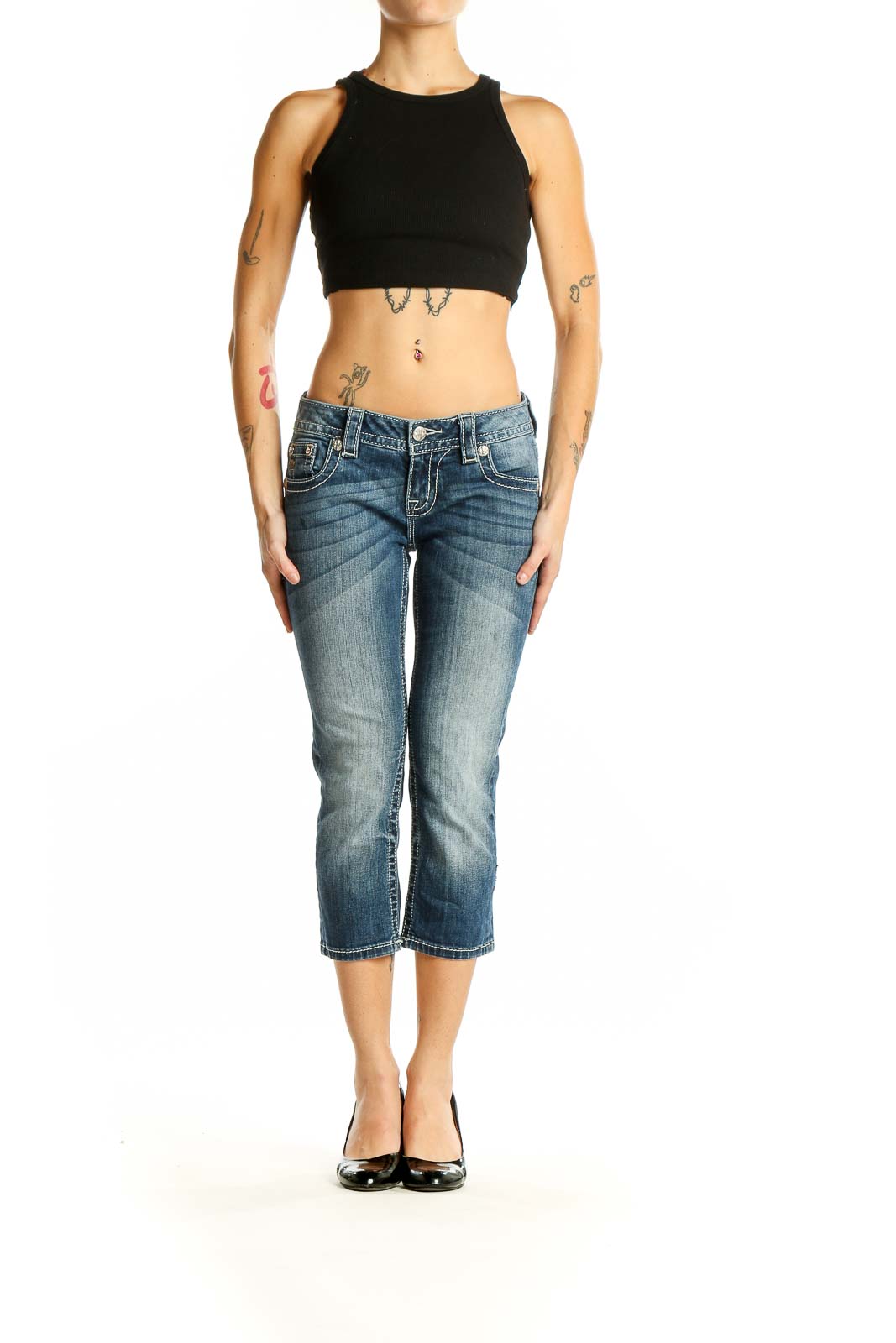 Front view of Miss Me blue faded cropped denim jeans on model