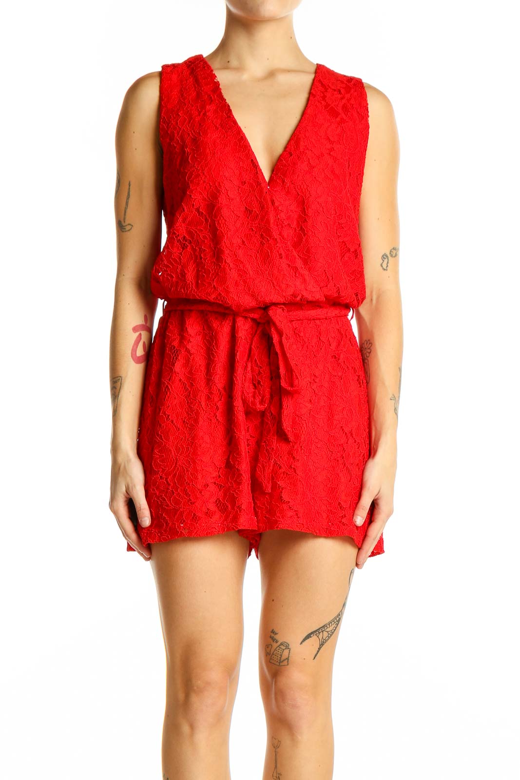 Front view of red lace sleeveless romper with V-neckline and tie waist