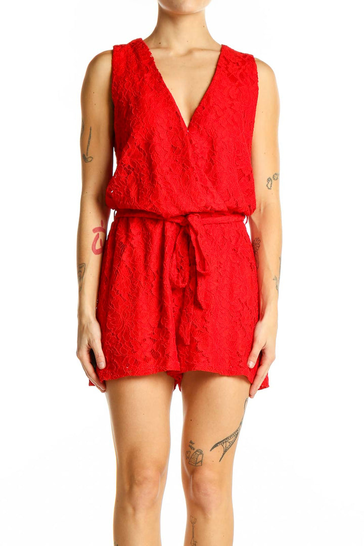 Front view of red lace sleeveless romper with V-neckline and tie waist