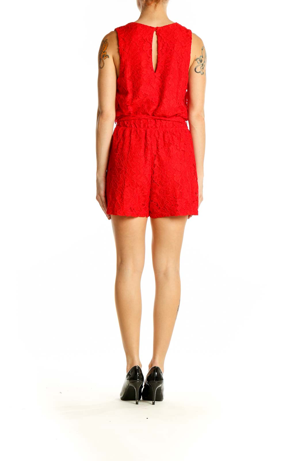 Side view of red lace sleeveless romper showing wrap-style design