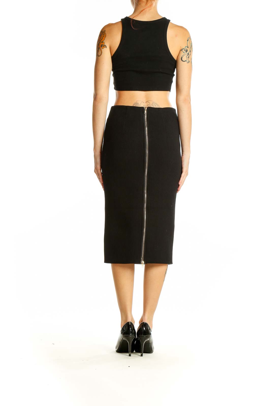 Side view of model wearing Six Crisp Days black ribbed midi pencil skirt with matching crop top