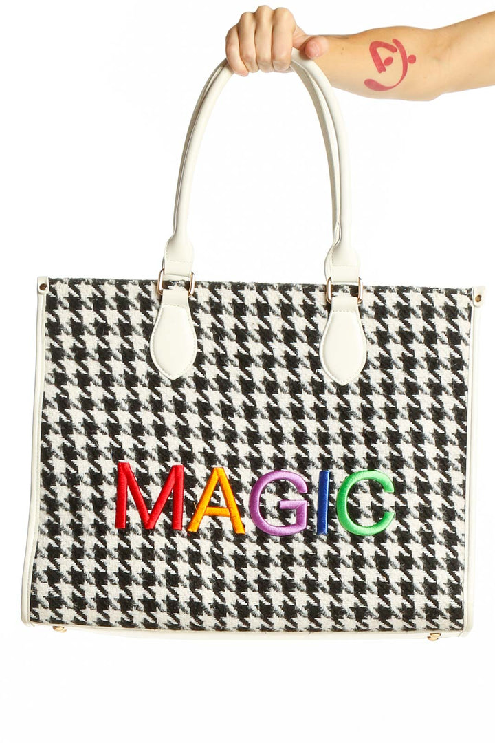 Front view of Magic Hill houndstooth tote bag with rainbow logo