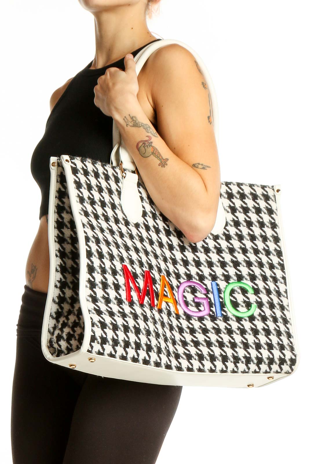 Front view of Magic Hill houndstooth tote bag with rainbow logo