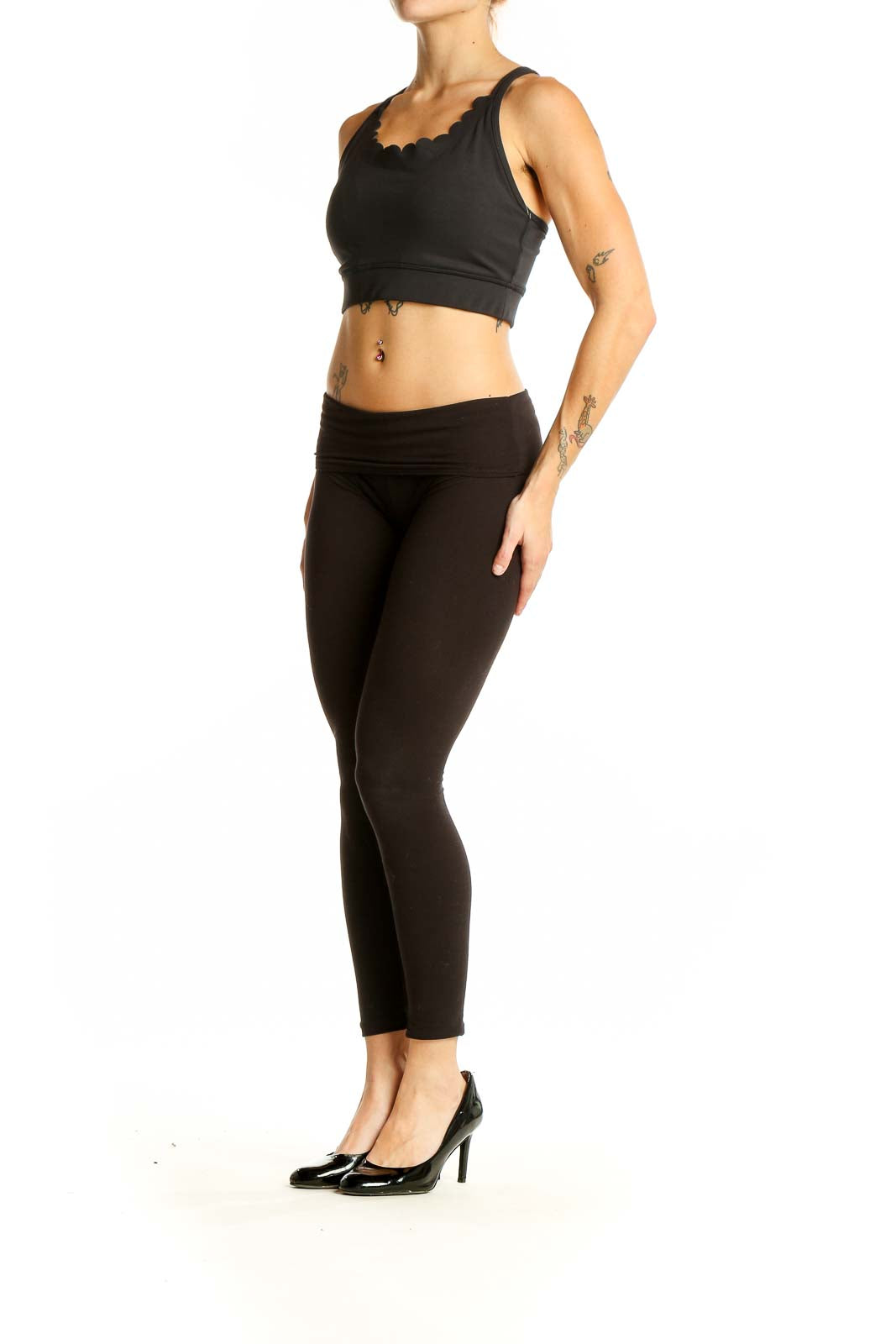 Front view of black Kate Spade crop top with scalloped neckline