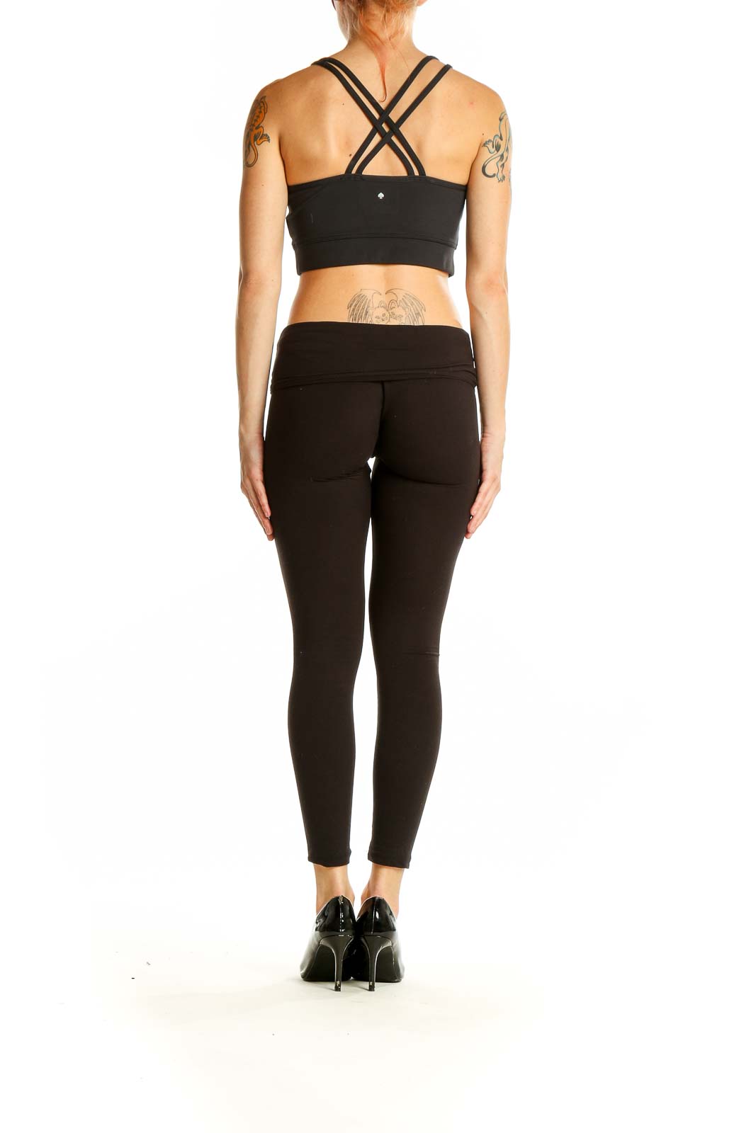 Side view of black Kate Spade crop top and matching leggings