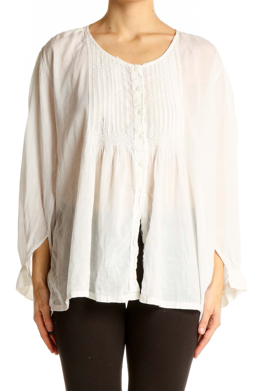 Front view of white pintuck blouse with flowy silhouette