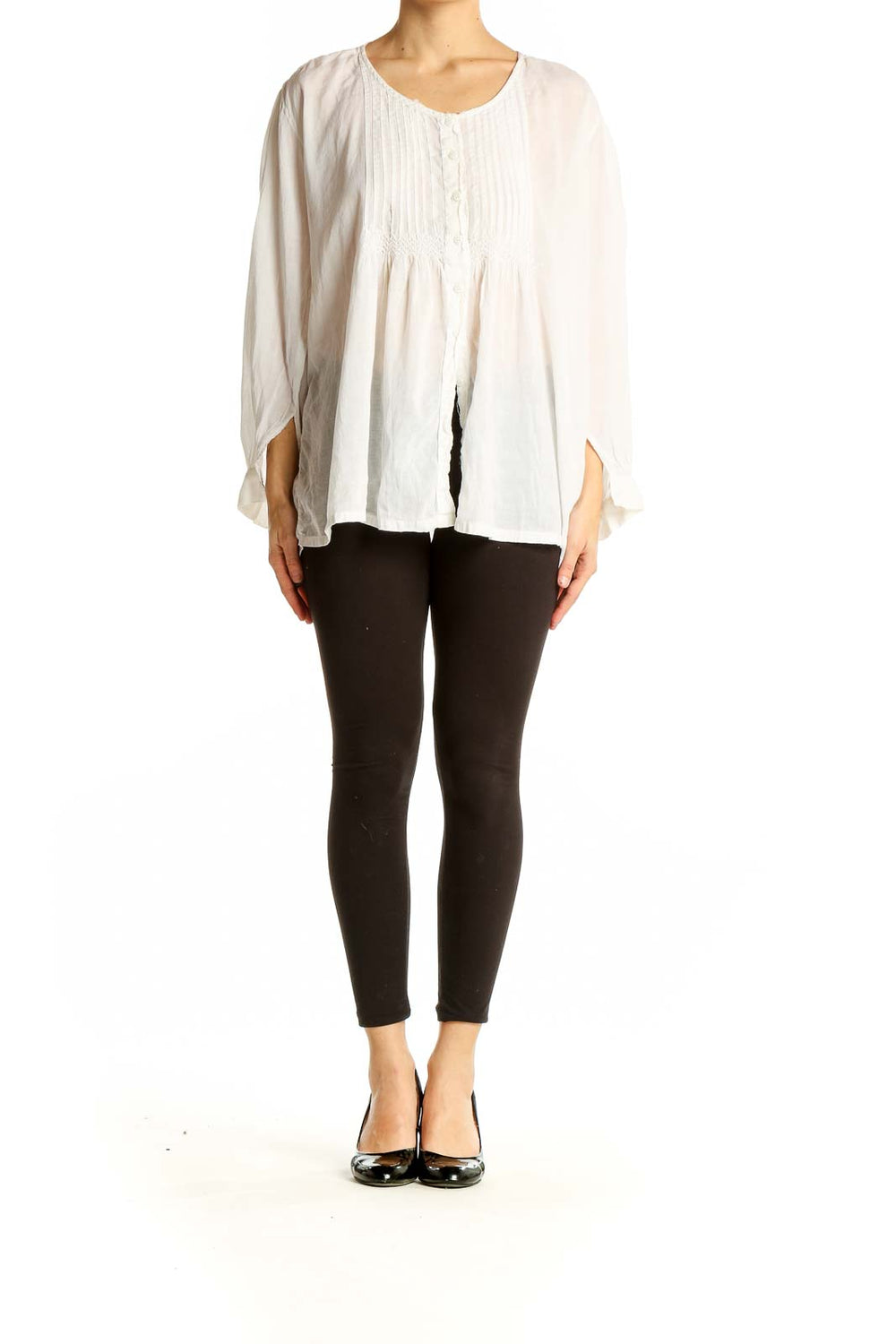 Front view of white pintuck blouse with flowy silhouette