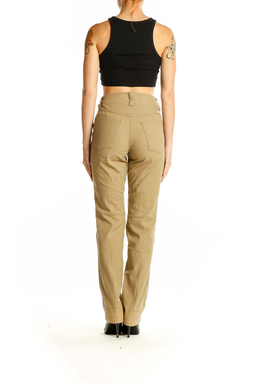 Side view of woman wearing Wrangler khaki straight leg pants with black top