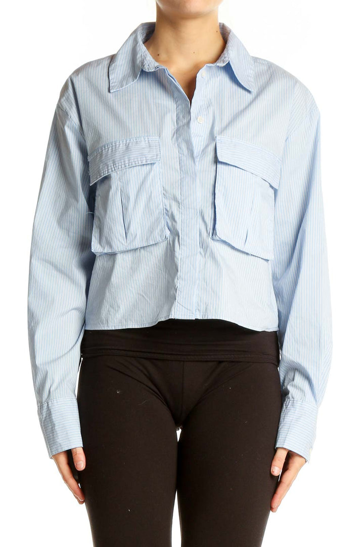 Front view of Zara light blue striped cropped button-up shirt with oversized pockets